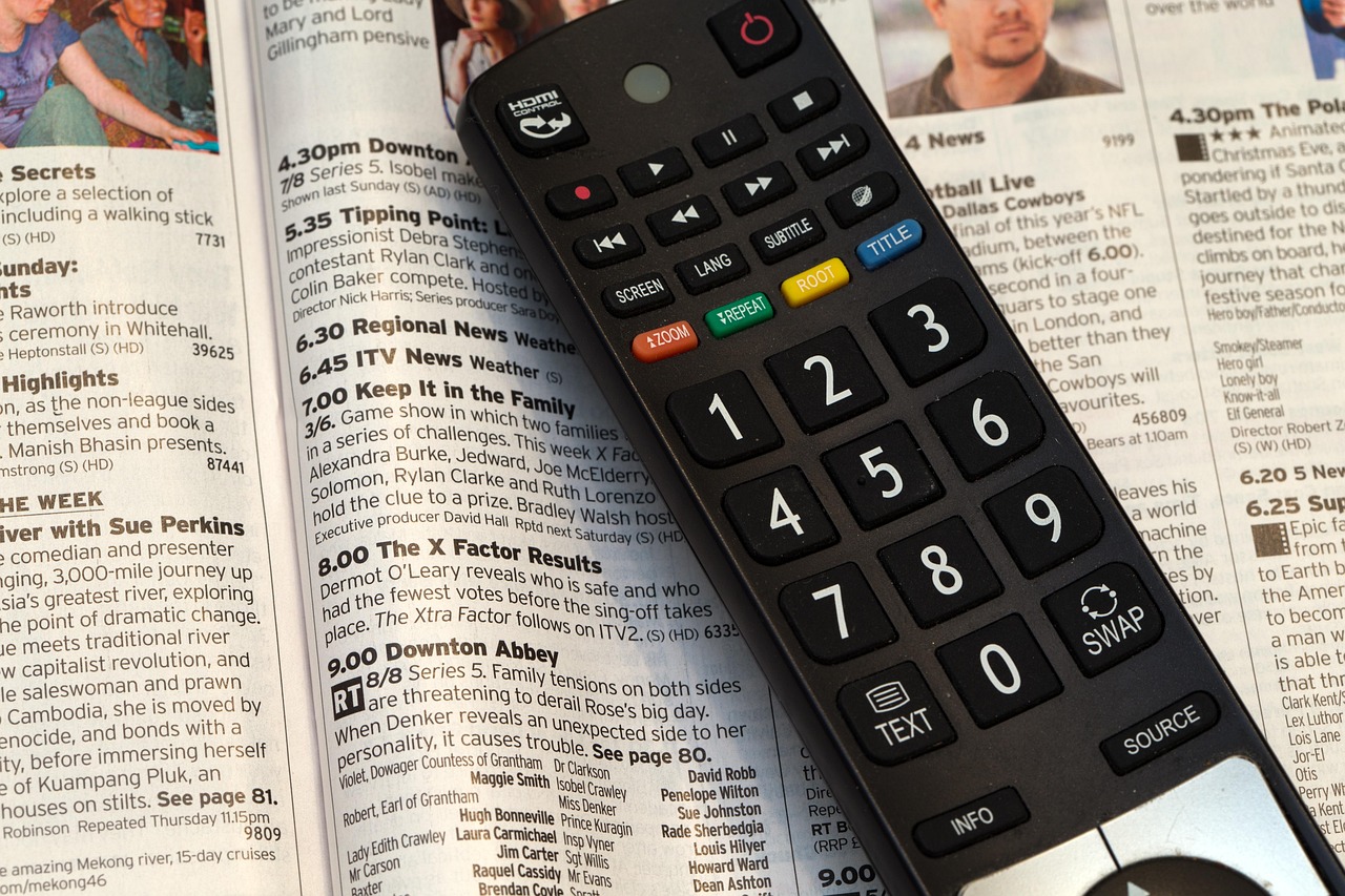 Television remote control with streaming device for IPTV setup — equipment needed to watch IPTV